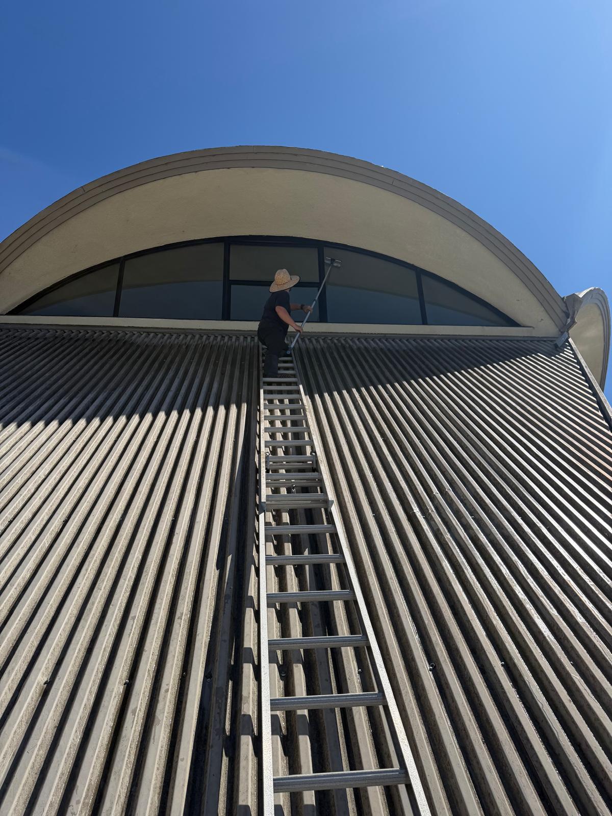 Commercial high-reach window cleaning and solar panel washing in San Jose CA